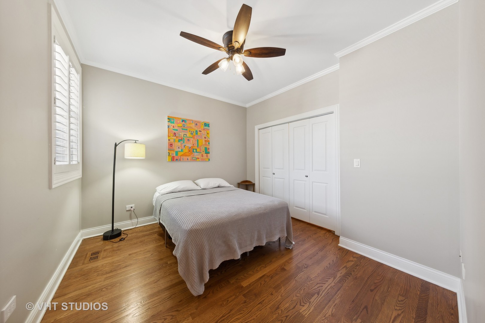 2136 West Division Street, Unit 3 Chicago, IL 60622 - Photo 24 of 37 a bedroom with a bed and a ceiling fan