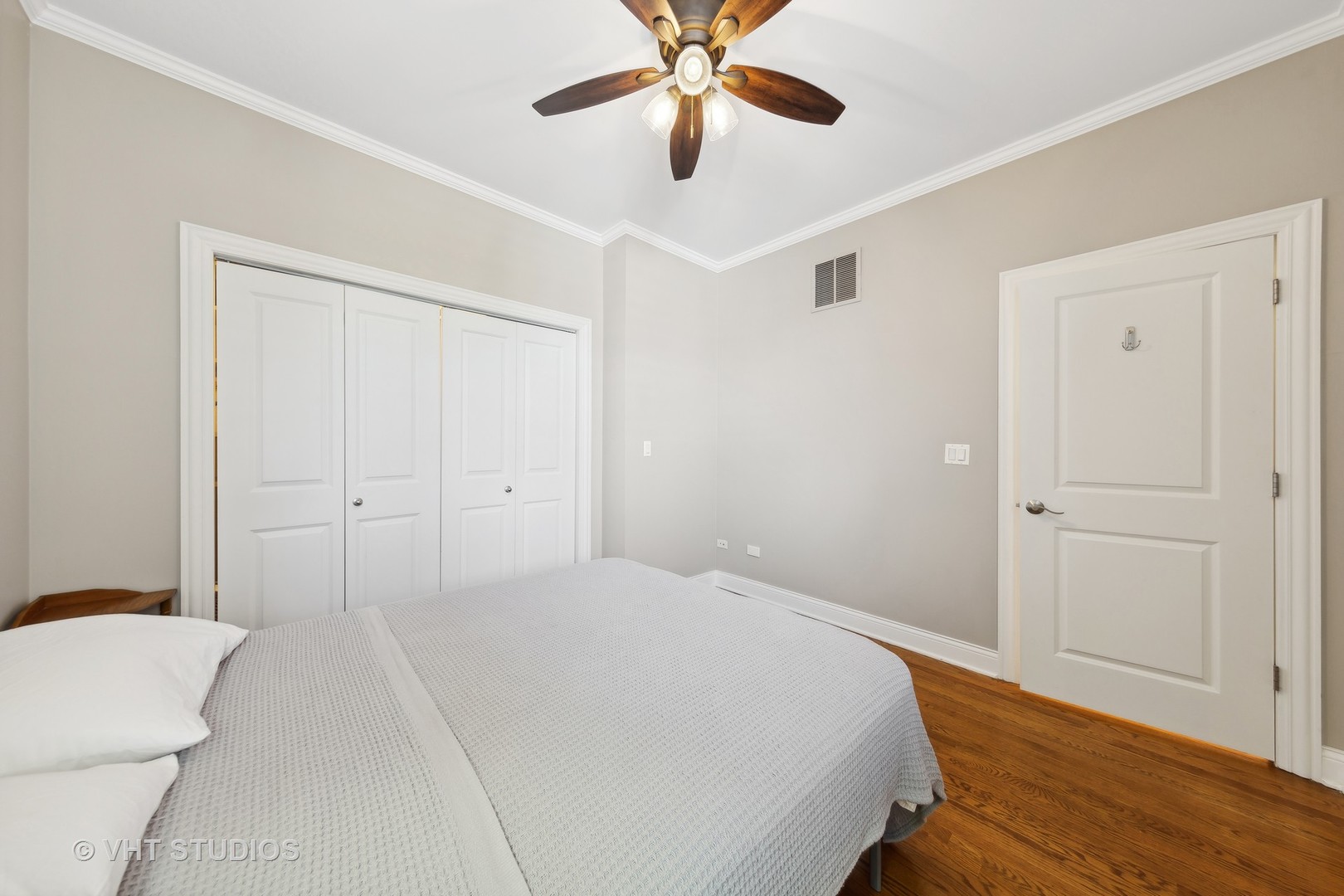 2136 West Division Street, Unit 3 Chicago, IL 60622 - Photo 25 of 37 a bedroom with a bed and a ceiling fan