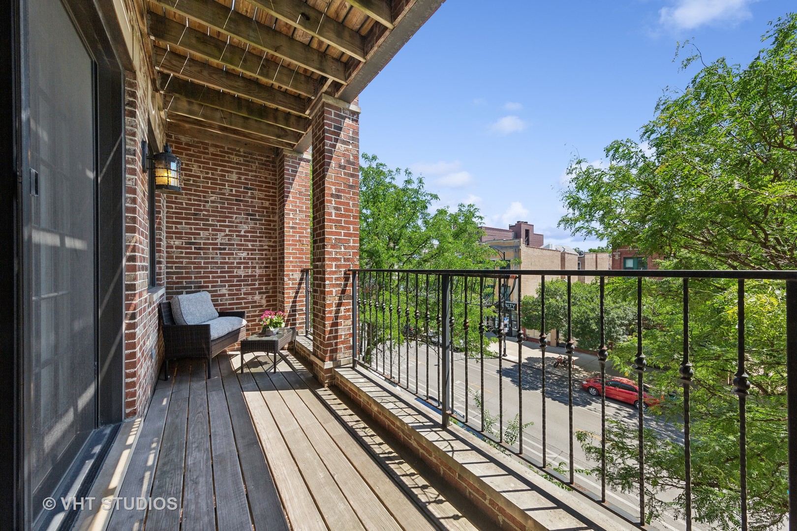 2136 West Division Street, Unit 3 Chicago, IL 60622 - Photo 28 of 37 a view of balcony with wooden floor and fence