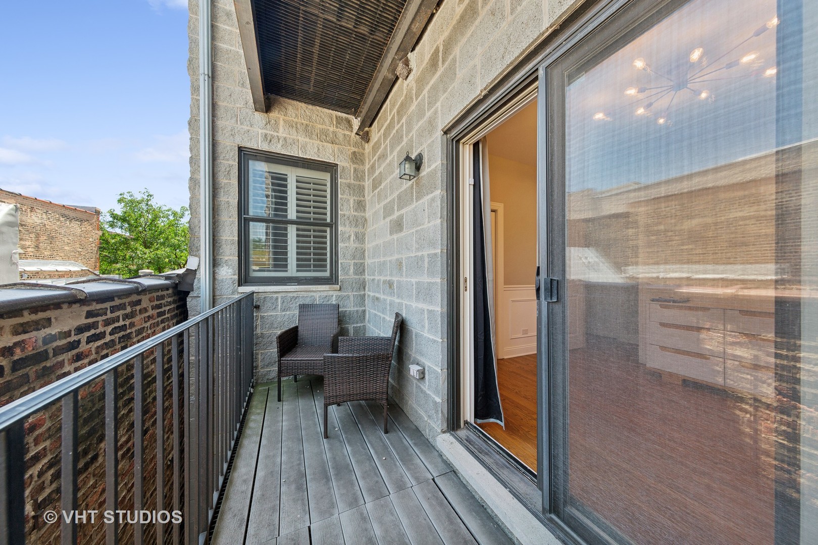 2136 West Division Street, Unit 3 Chicago, IL 60622 - Photo 30 of 37 a balcony with chairs and wooden floor
