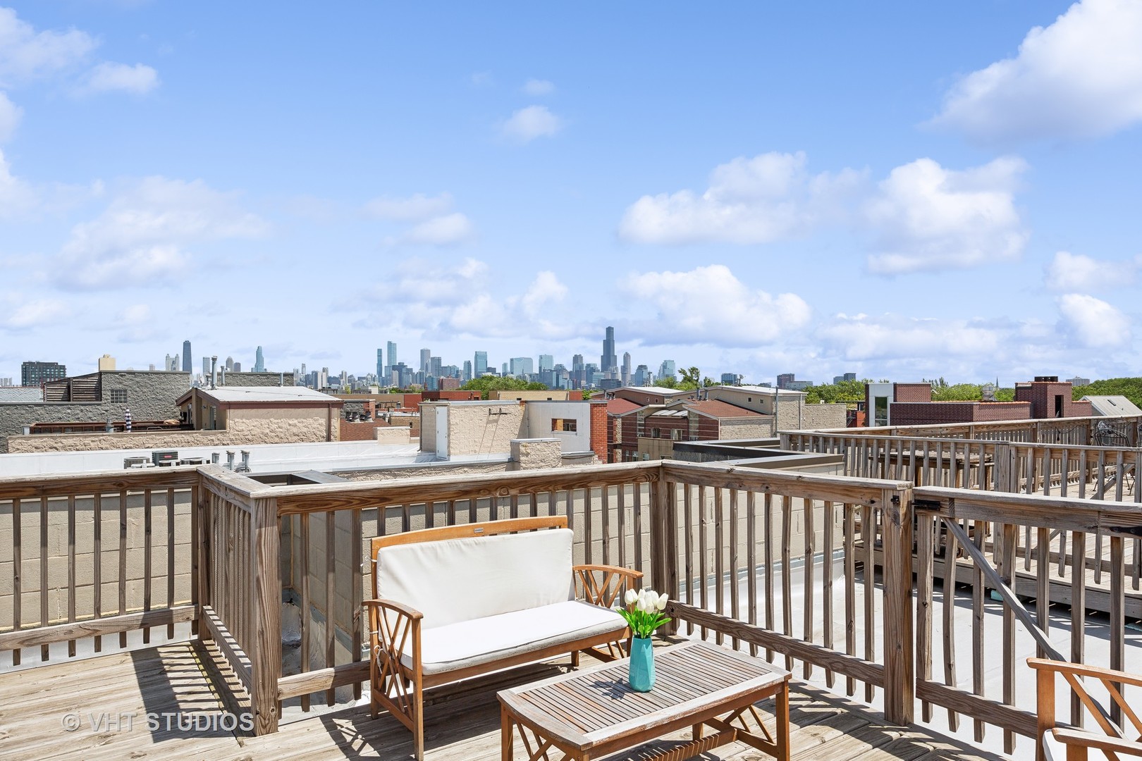 2136 West Division Street, Unit 3 Chicago, IL 60622 - Photo 32 of 37 a view of a balcony with wooden benches