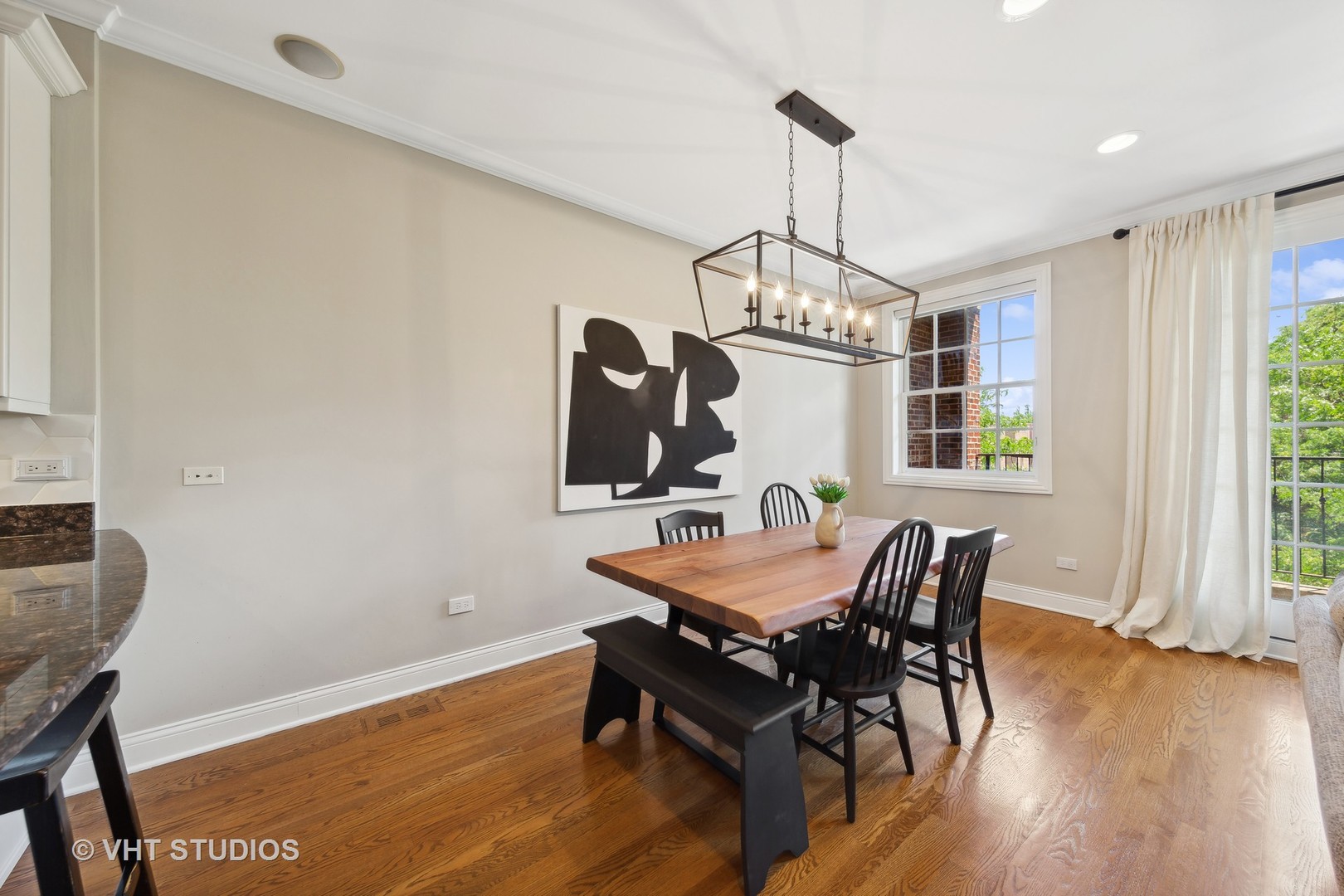 2136 West Division Street, Unit 3 Chicago, IL 60622 - Photo 8 of 37 a view of a dining room with furniture window and wooden floor