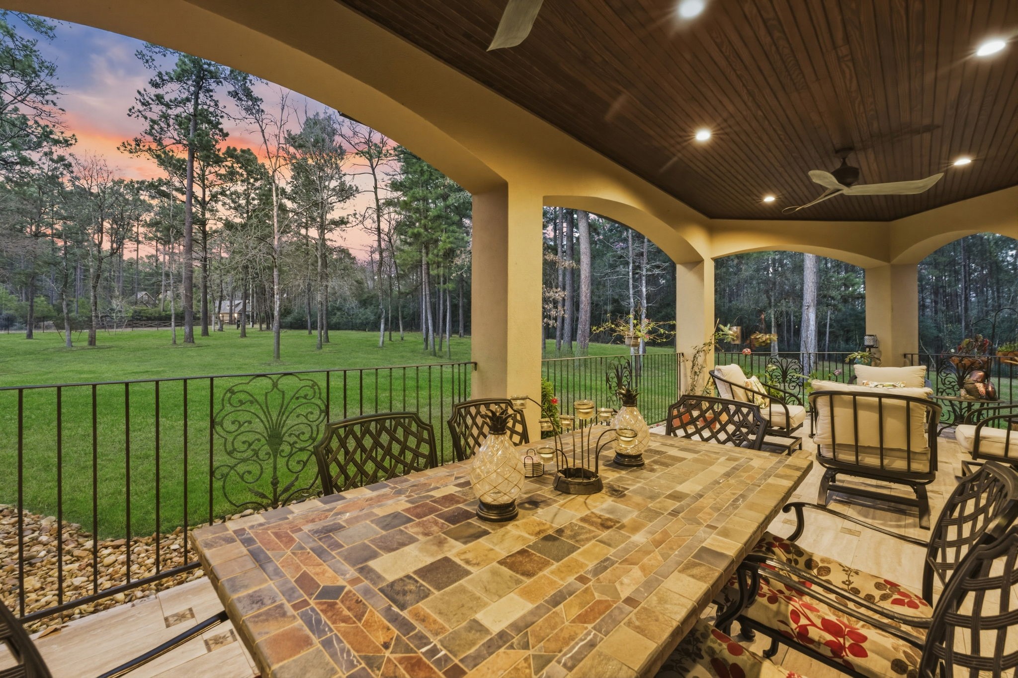 280 Sundog Road Huntsville, TX 77340 - Photo 9 of 50 Inviting loggia just off the dining room offers a wonderful outdoor space for dining or relaxing while enjoying views of the front grounds.