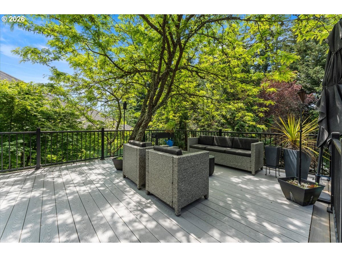 12431 Southwest 55th Place Portland, OR 97219 - Photo 39 of 40 a view of a couches and a table in the patio