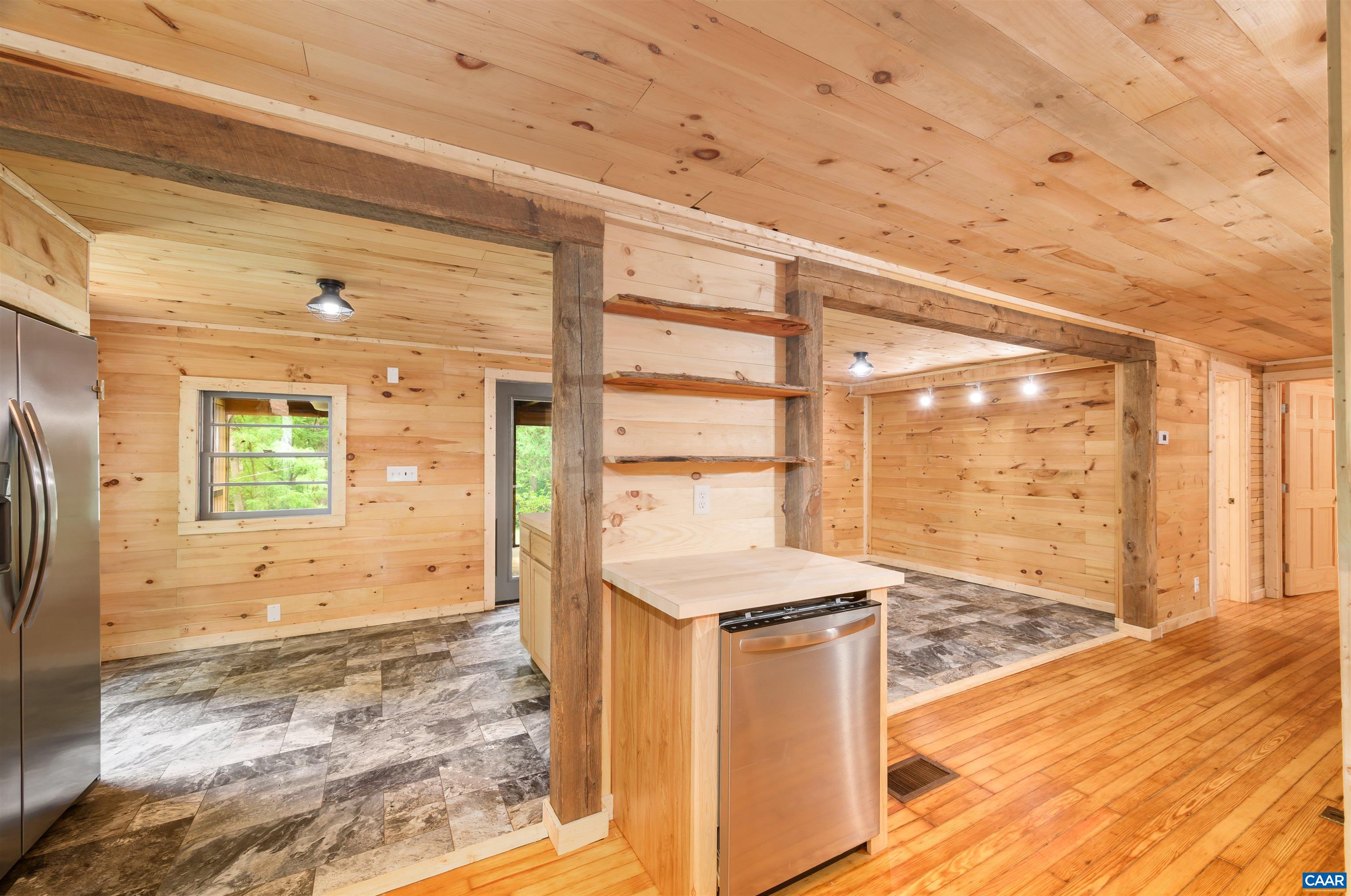 3882 Firehouse Road Howardsville, VA 24562 - Photo 15 of 75 a view of a hallway with wooden floor and a outdoor space