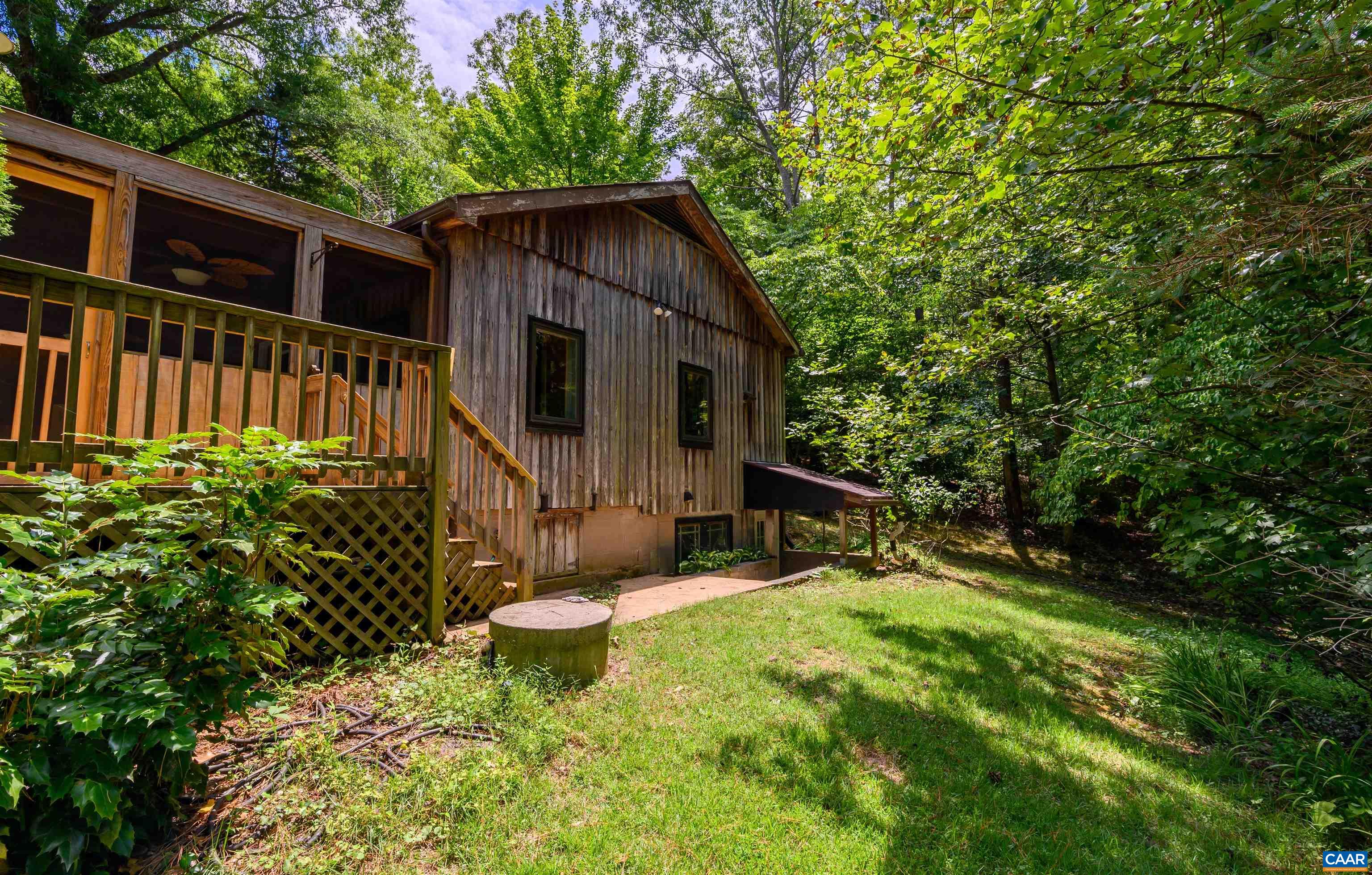 3882 Firehouse Road Howardsville, VA 24562 - Photo 34 of 75 a view of a house with backyard and sitting area