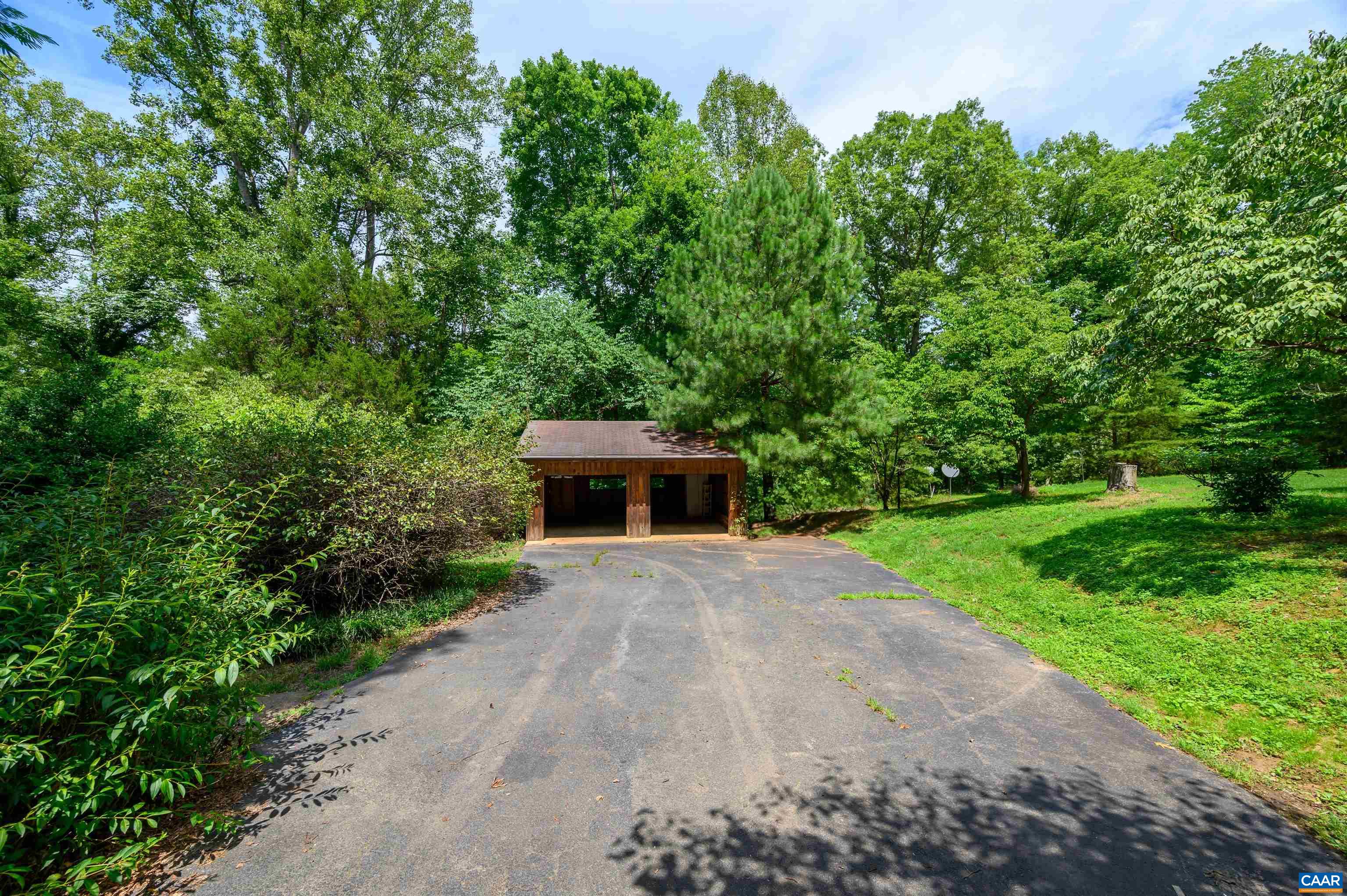 3882 Firehouse Road Howardsville, VA 24562 - Photo 44 of 75 a front view of a house with a yard and garage