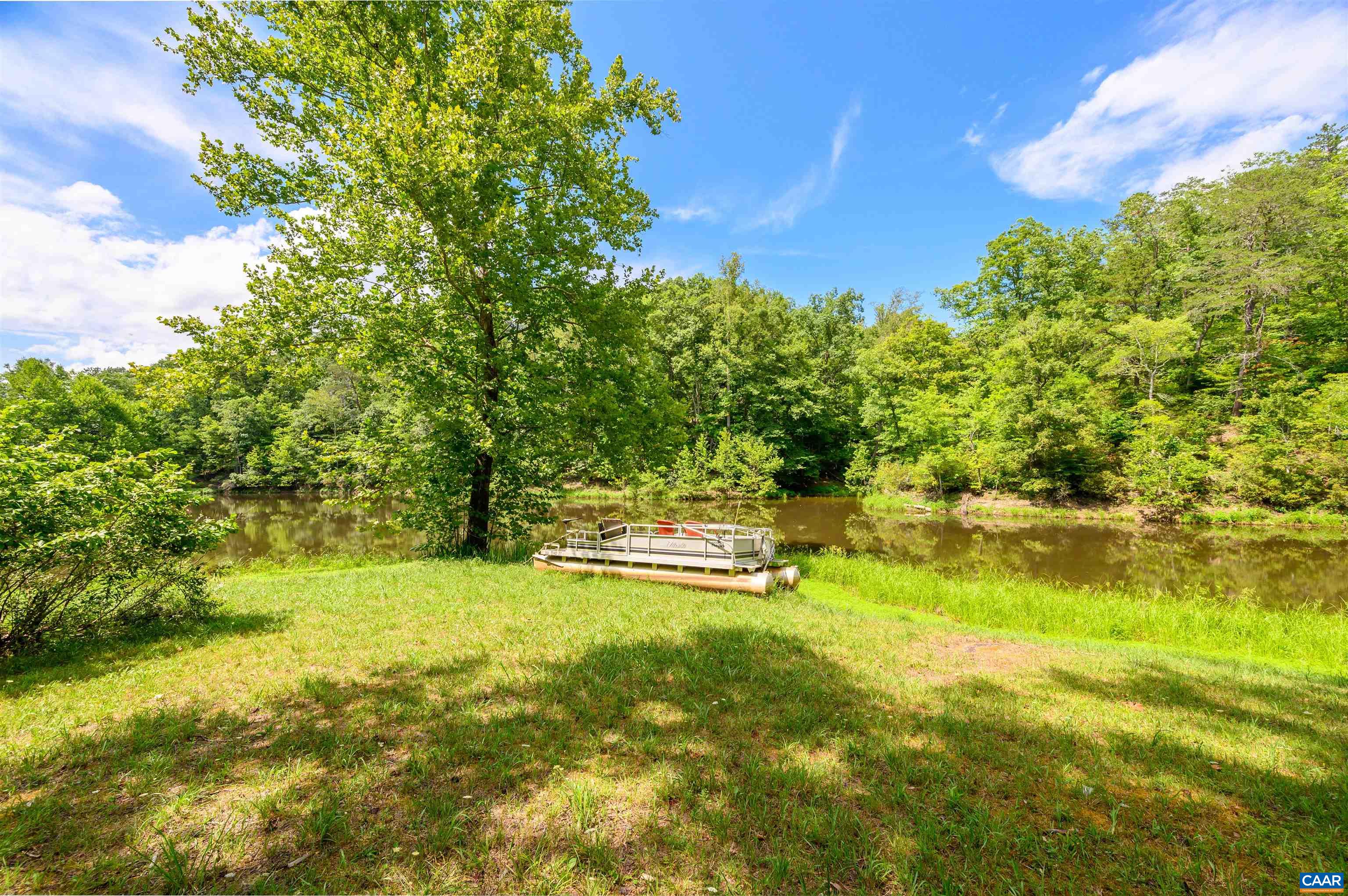 3882 Firehouse Road Howardsville, VA 24562 - Photo 51 of 75 a backyard of a house with a yard and outdoor seating