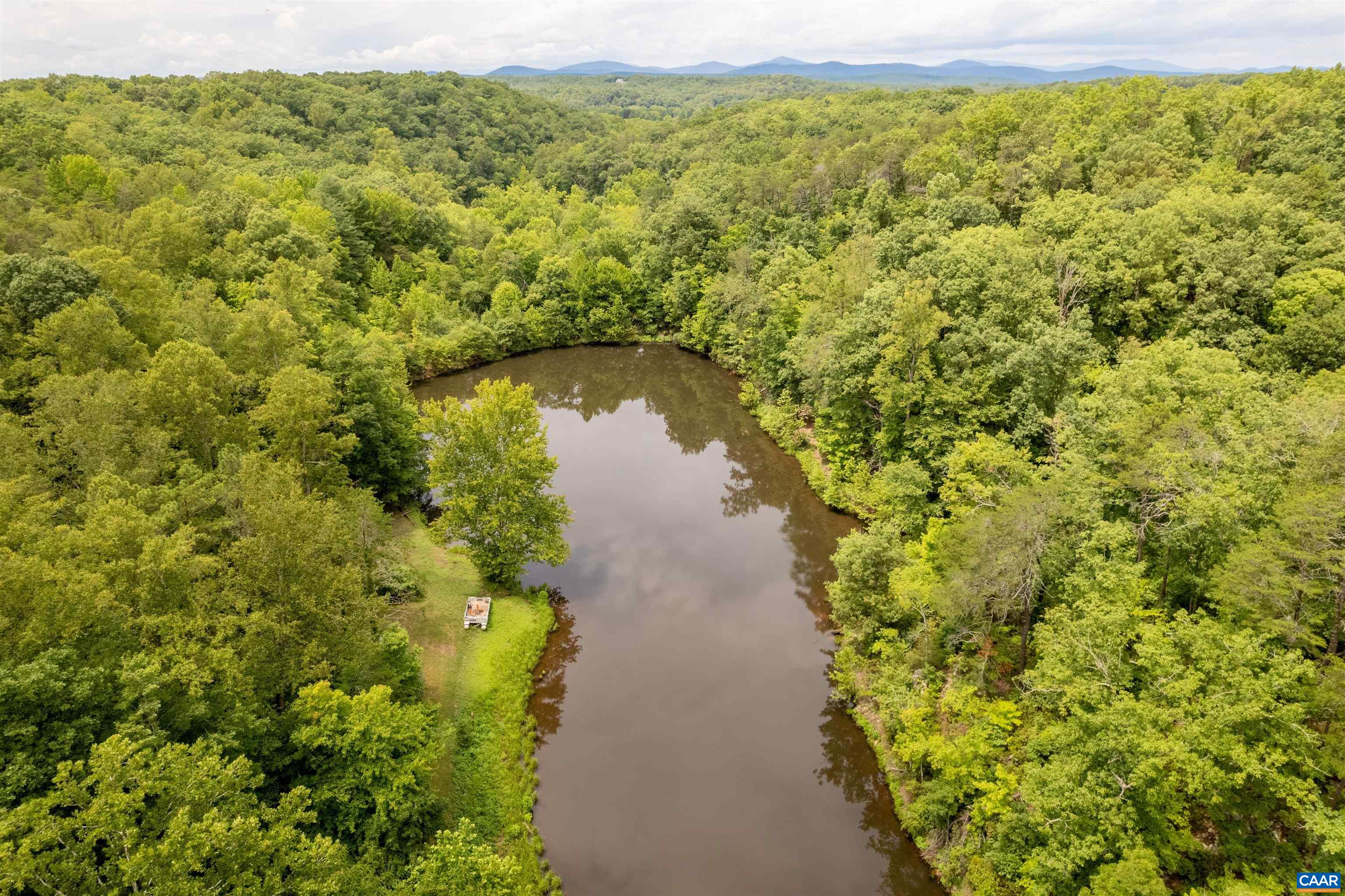 3882 Firehouse Road Howardsville, VA 24562 - Photo 63 of 75 a view of a lake with a building
