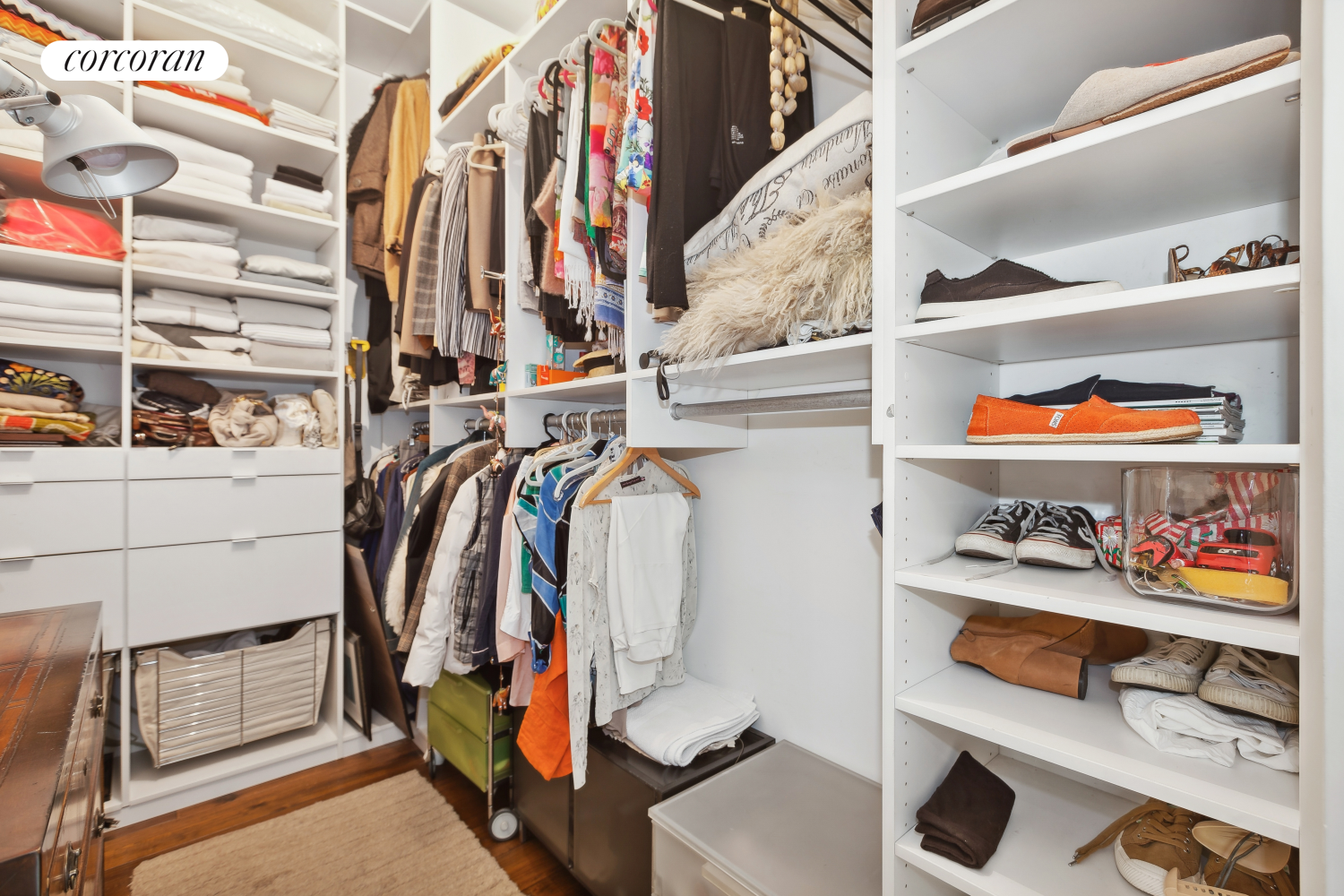 25 East 69th Street, Unit 3A Manhattan, NY 10021 - Photo 5 of 8 a view of walk in closet with clothes and shoes