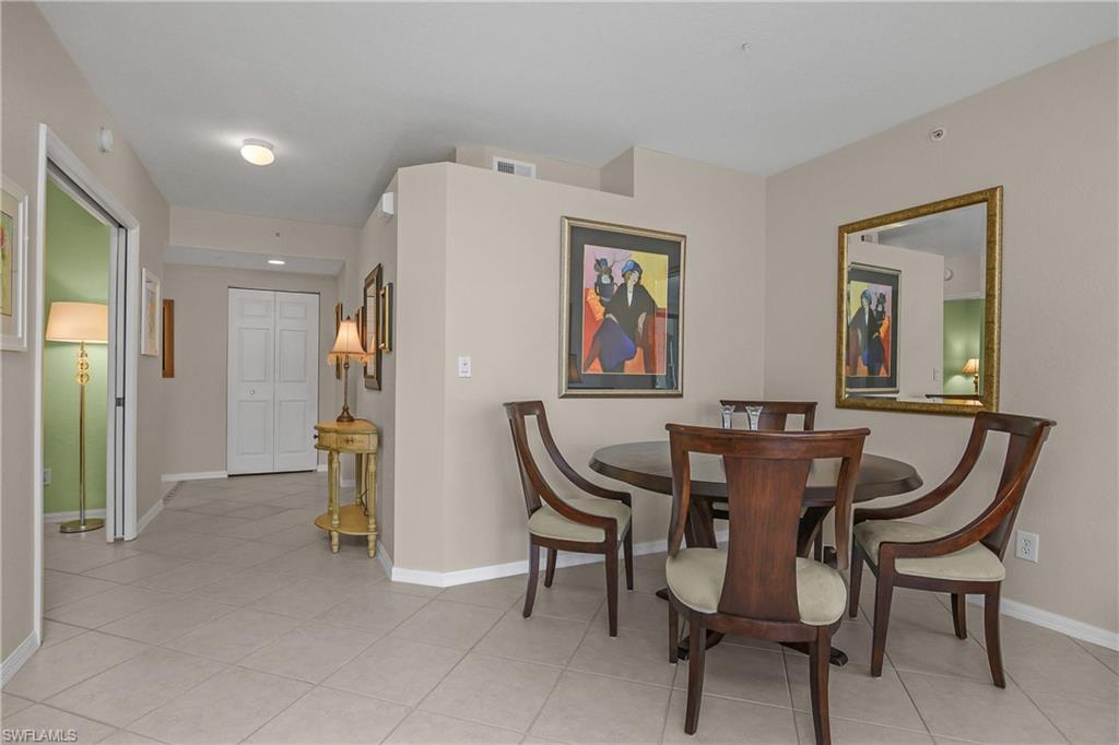 6838 Lantana Bridge Road, Unit 103 Naples, FL 34109 - Photo 7 of 41 a dining room with furniture and window