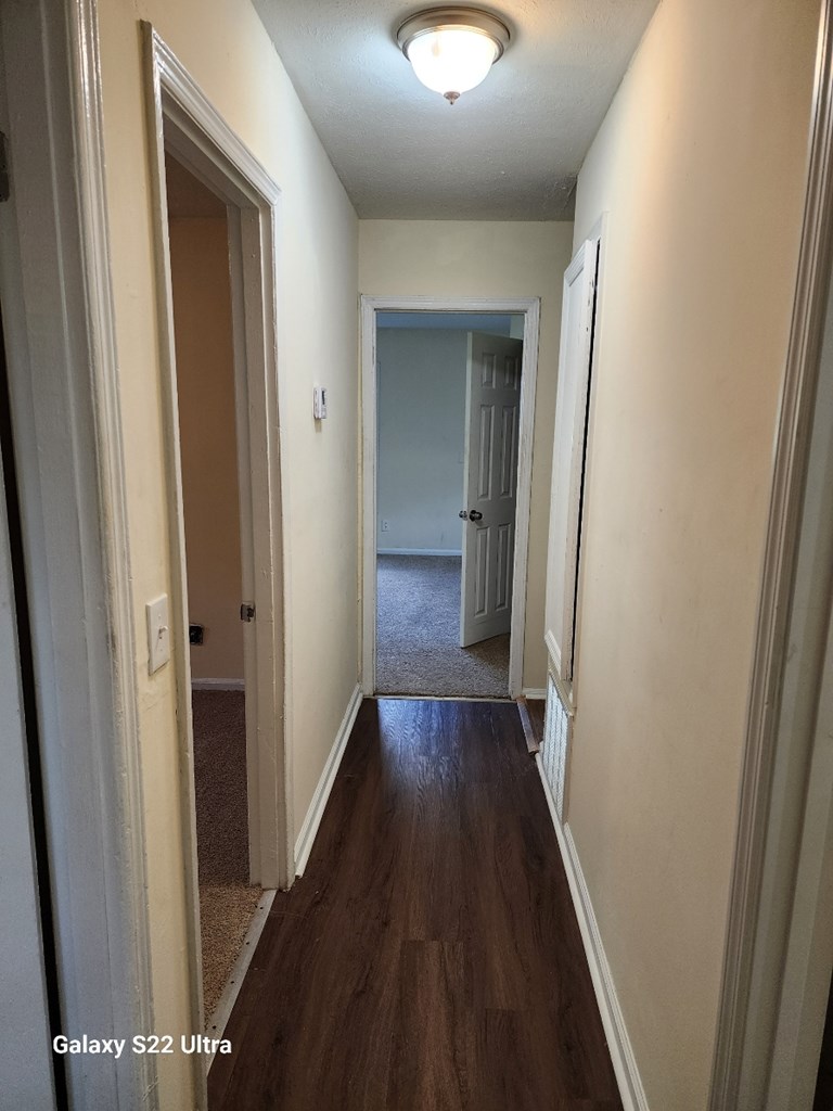 5118 11th Avenue Columbus, GA 31904 - Photo 3 of 12 a view of a hallway with wooden floor