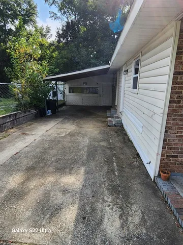 a view of house with trees in the background