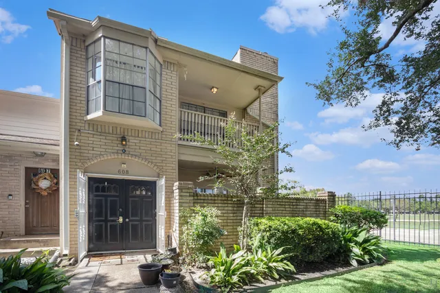 a front view of a building with garden