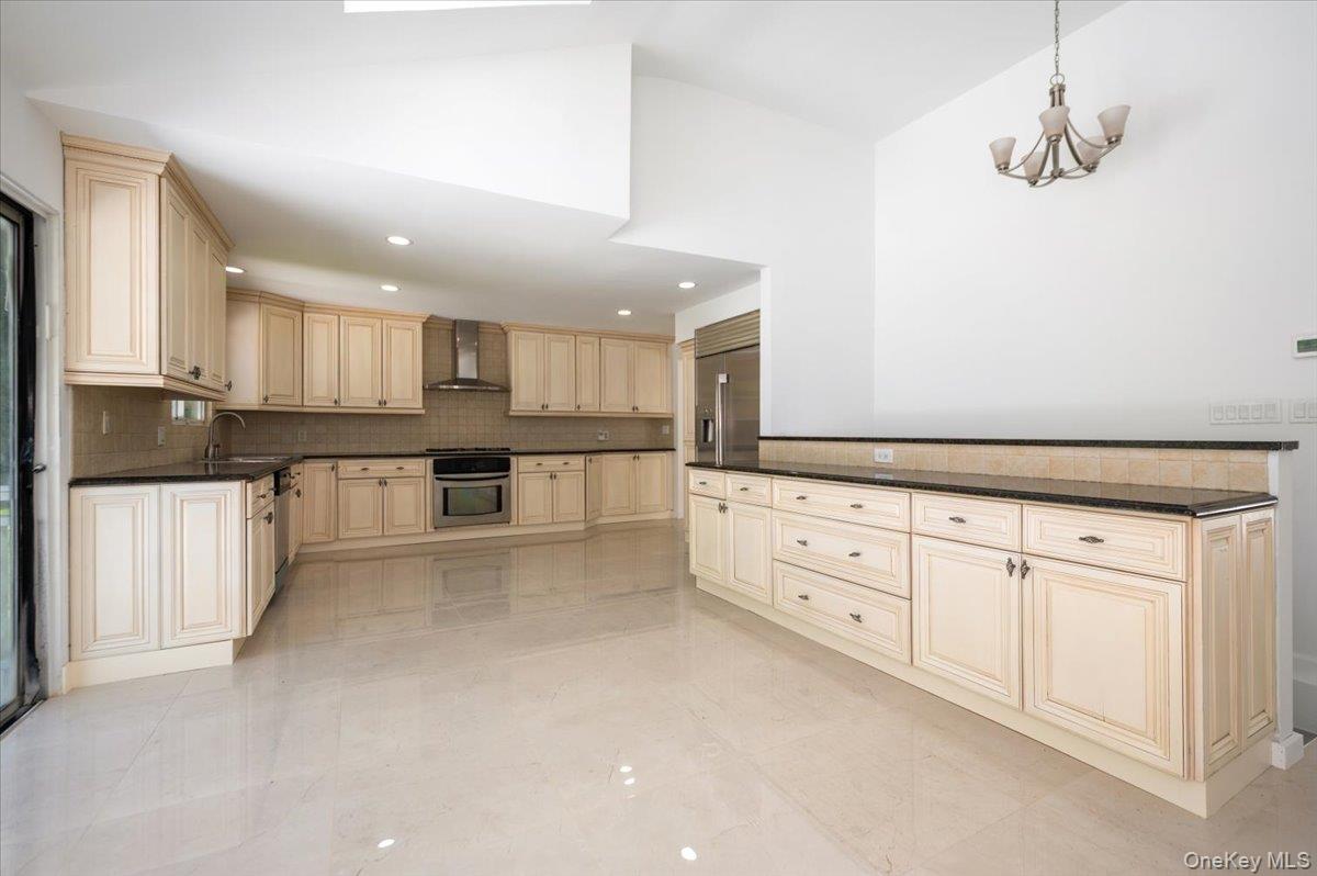 452 East Shore Road Great Neck, NY 11024 - Photo 11 of 35 a large kitchen with cabinets