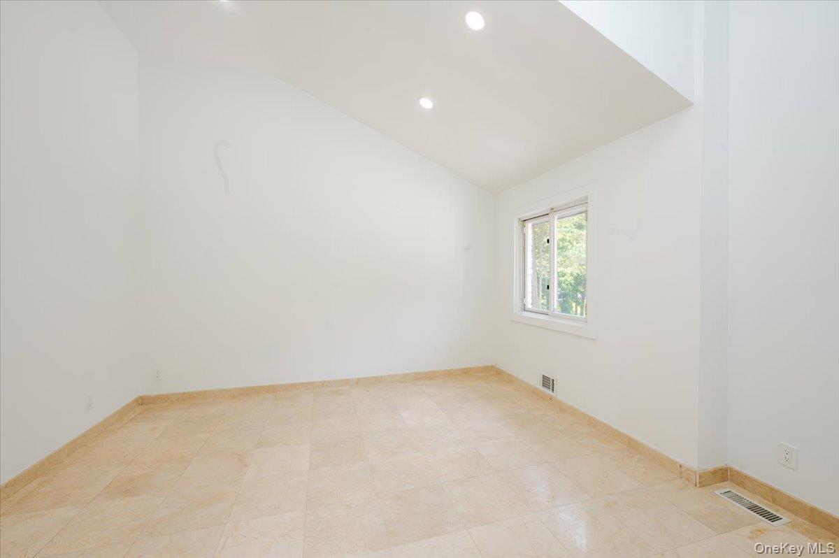 452 East Shore Road Great Neck, NY 11024 - Photo 20 of 35 an empty room with a window