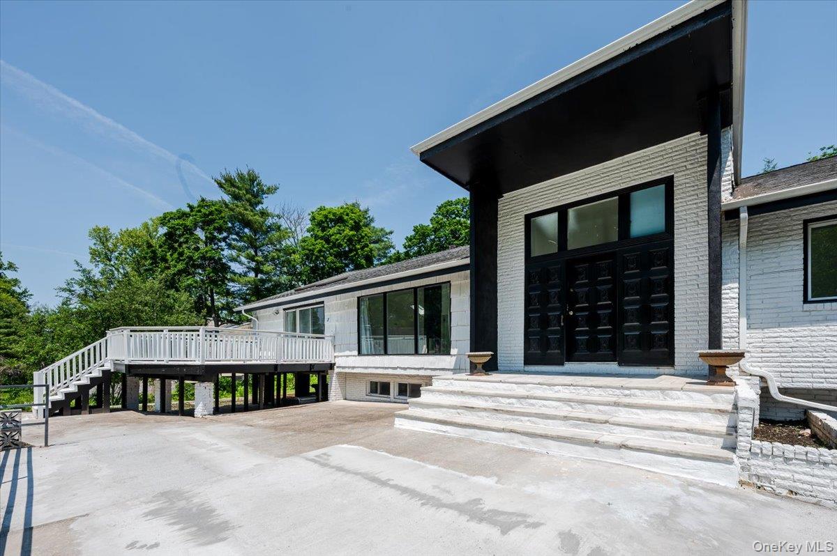 452 East Shore Road Great Neck, NY 11024 - Photo 2 of 35 a view of a house with a balcony
