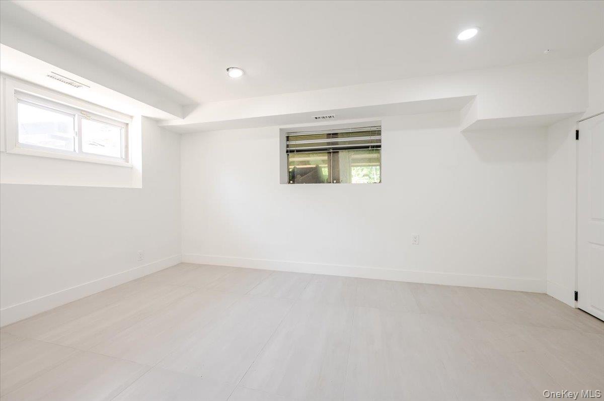 452 East Shore Road Great Neck, NY 11024 - Photo 22 of 35 an empty room with windows