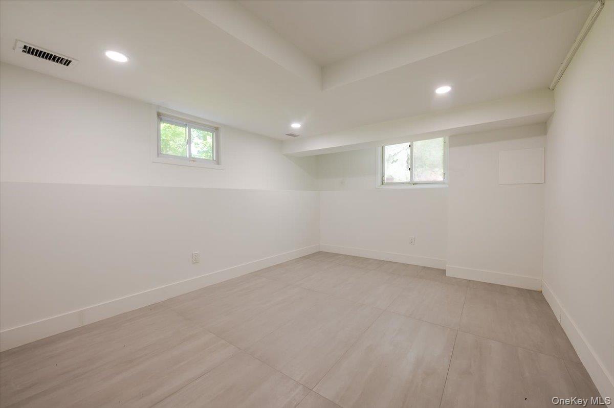 452 East Shore Road Great Neck, NY 11024 - Photo 23 of 35 an empty room with a window