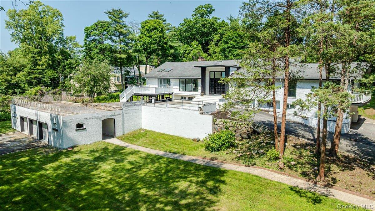 452 East Shore Road Great Neck, NY 11024 - Photo 27 of 35 a view of a house with yard and sitting area