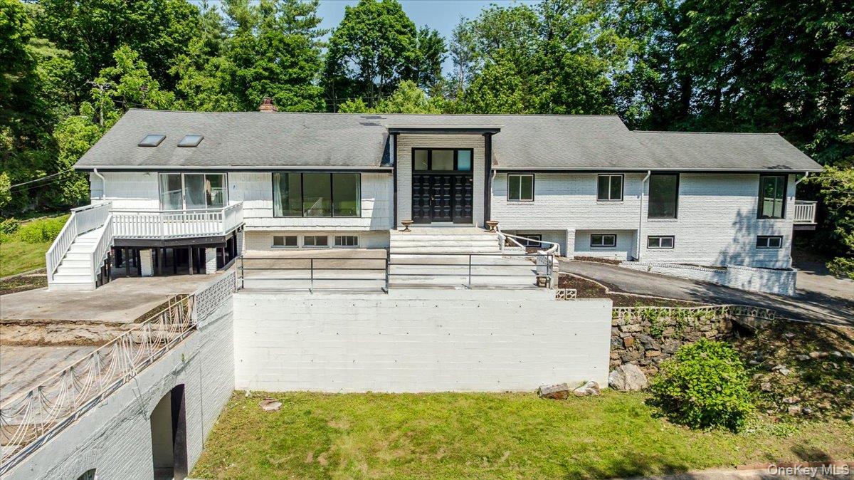 452 East Shore Road Great Neck, NY 11024 - Photo 28 of 35 front view of a house with a yard