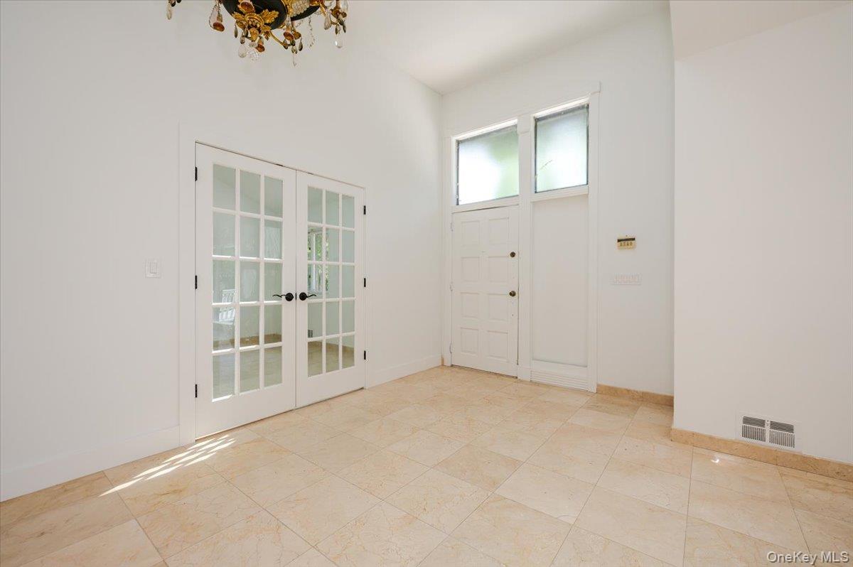 452 East Shore Road Great Neck, NY 11024 - Photo 3 of 35 an empty room with windows