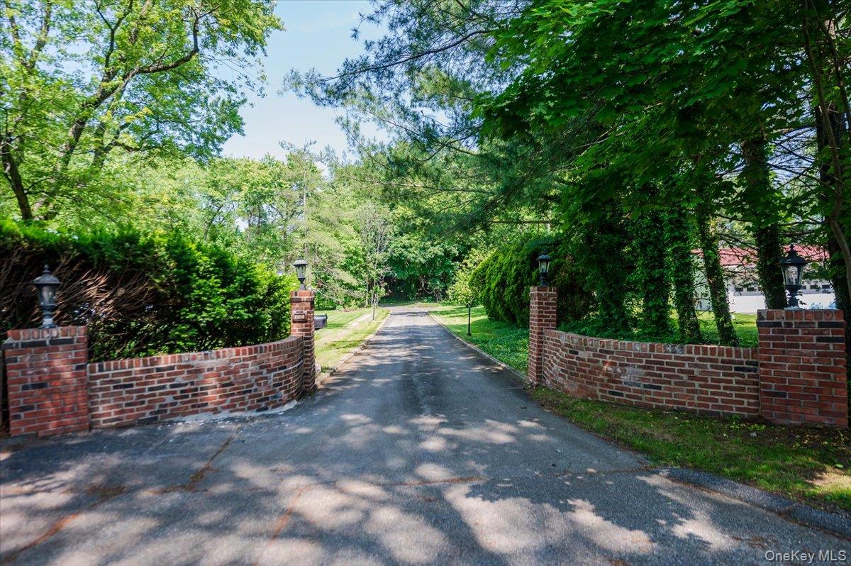 452 East Shore Road Great Neck, NY 11024 - Photo 32 of 35 a view of a yard with wooden fence