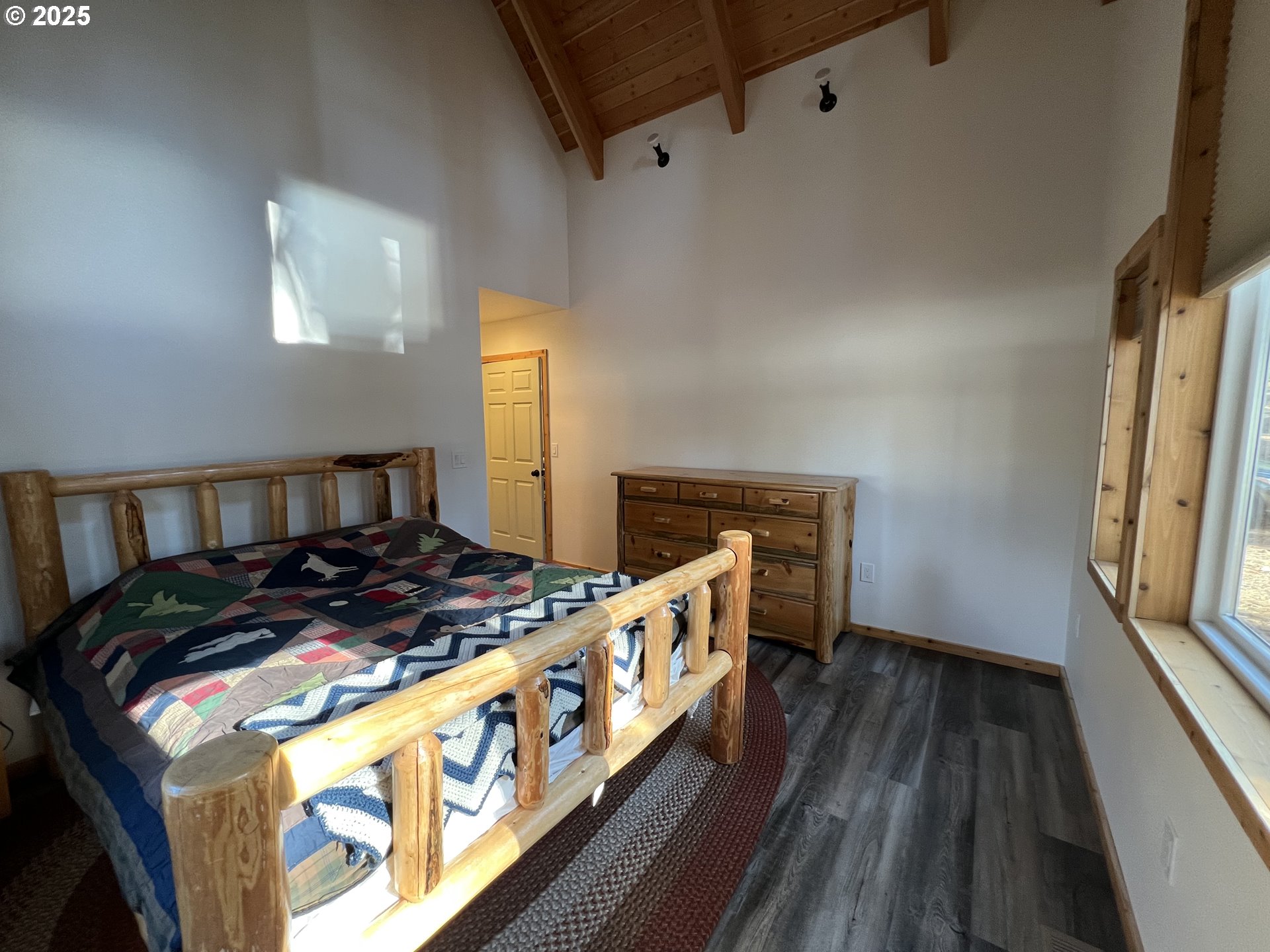 455 East Auburn Street Sumpter, OR 97877 - Photo 12 of 25 a bedroom with furniture and a wooden floor