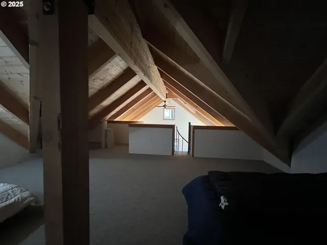 a view of living room with furniture and fireplace