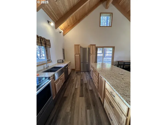 a view of a kitchen from a hallway
