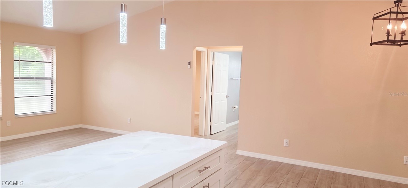 930 Southwest 34th Street Cape Coral, FL 33914 - Photo 22 of 31 an empty room with windows and entrance