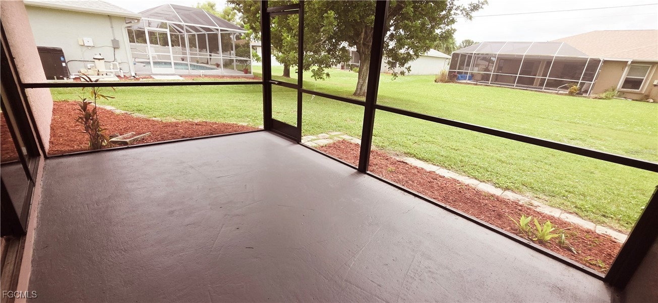 930 Southwest 34th Street Cape Coral, FL 33914 - Photo 27 of 31 a view of swimming pool with a yard and sitting area