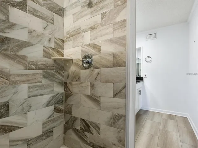 a bathroom with double sink and a mirror