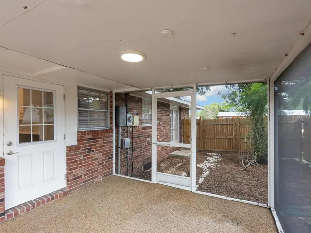 a view of a room with porch and wooden floor