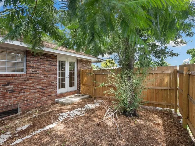 a view of backyard with small cabin