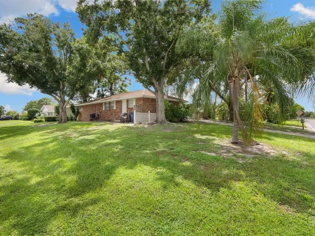 a view of a house with a big yard