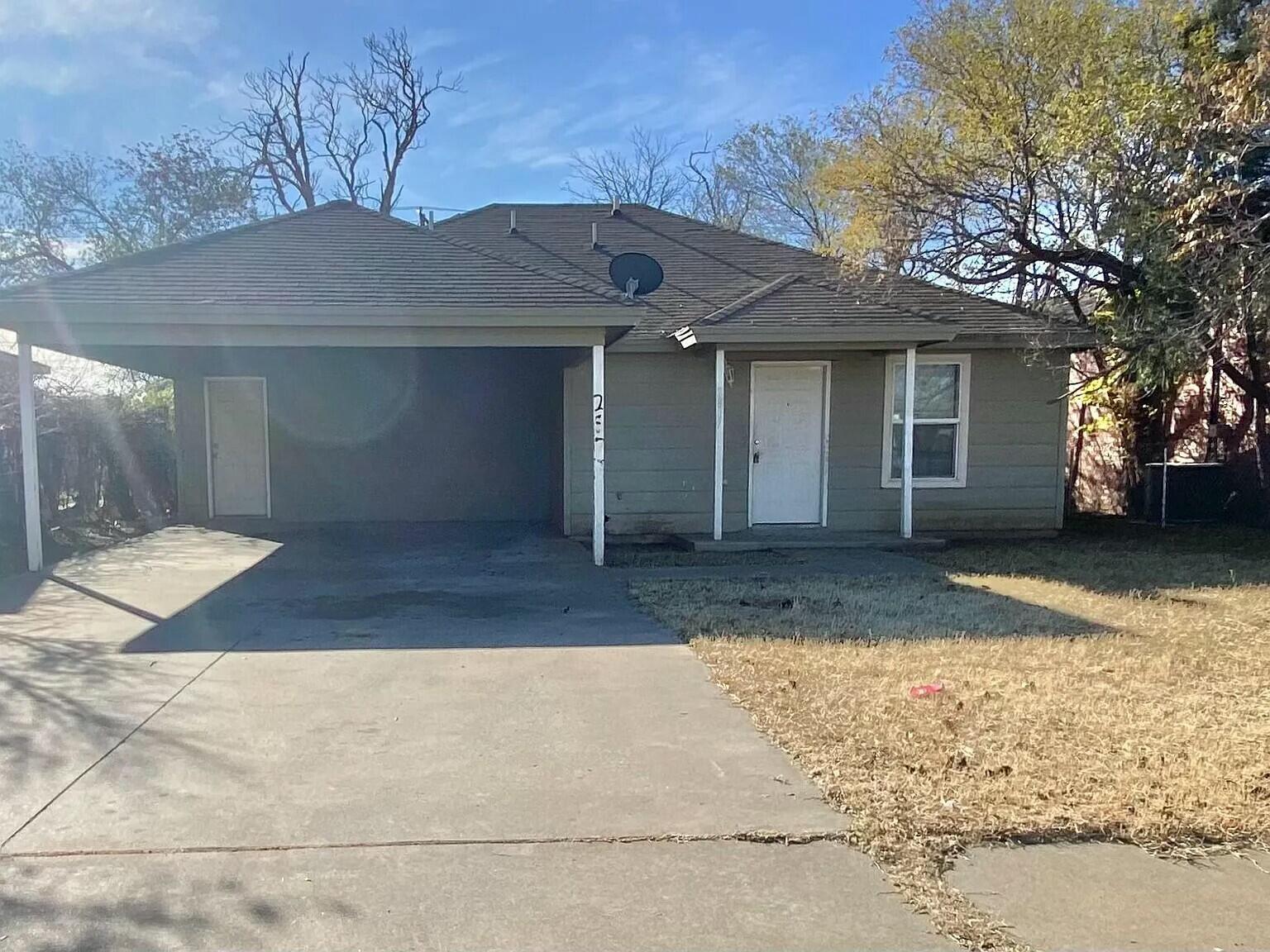 Package Package Property Lubbock, TX 79415 - Photo 19 of 45 a front view of a house with a yard and garage