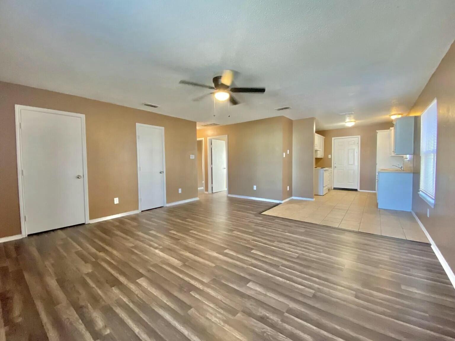 Package Package Property Lubbock, TX 79415 - Photo 21 of 45 a view of an empty room with a ceiling fan and window