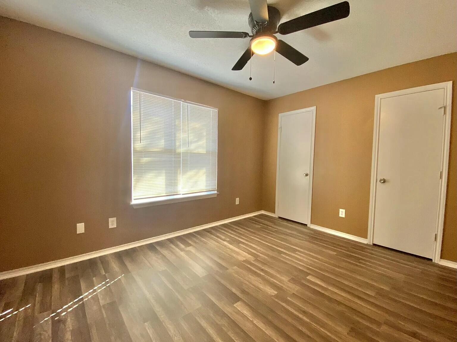 Package Package Property Lubbock, TX 79415 - Photo 28 of 45 wooden floor in an empty room with a window