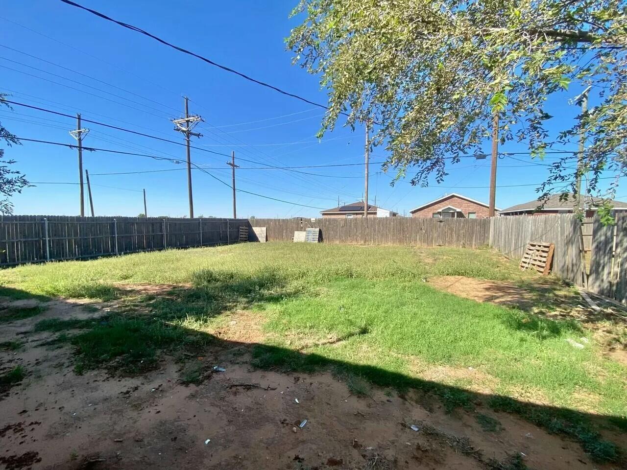 Package Package Property Lubbock, TX 79415 - Photo 45 of 45 a view of a yard with wooden fence