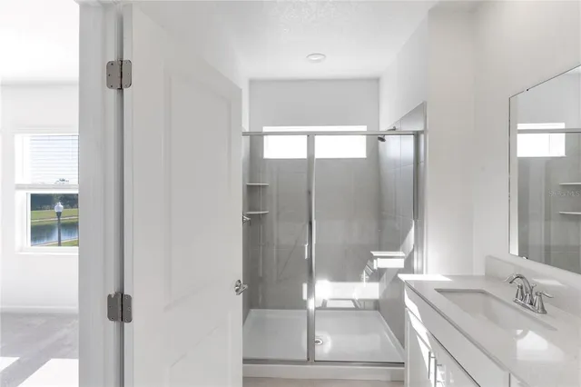 a bathroom with a sink toilet and mirror