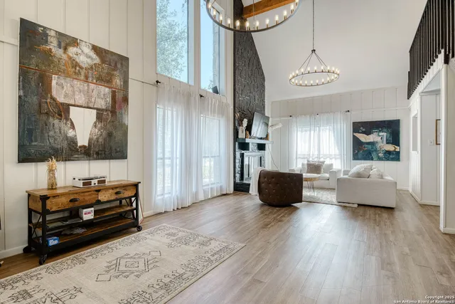 a living room with furniture window and wooden floor