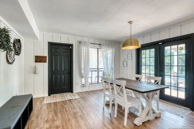 a dining room with furniture window wooden floor
