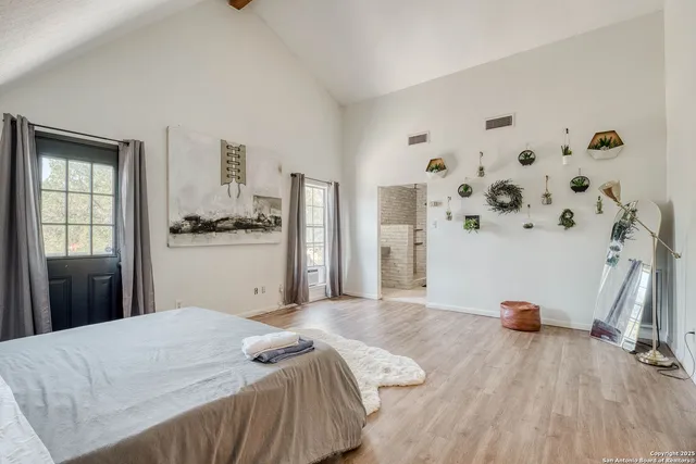 a bedroom with a bed and a window