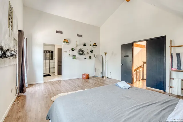 a bed room with a bed and a window