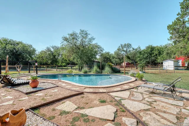 a view of a swimming pool with a sitting space