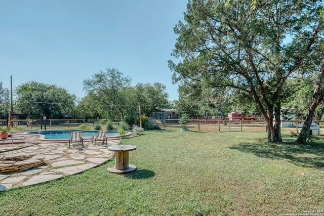 a view of a backyard with trees