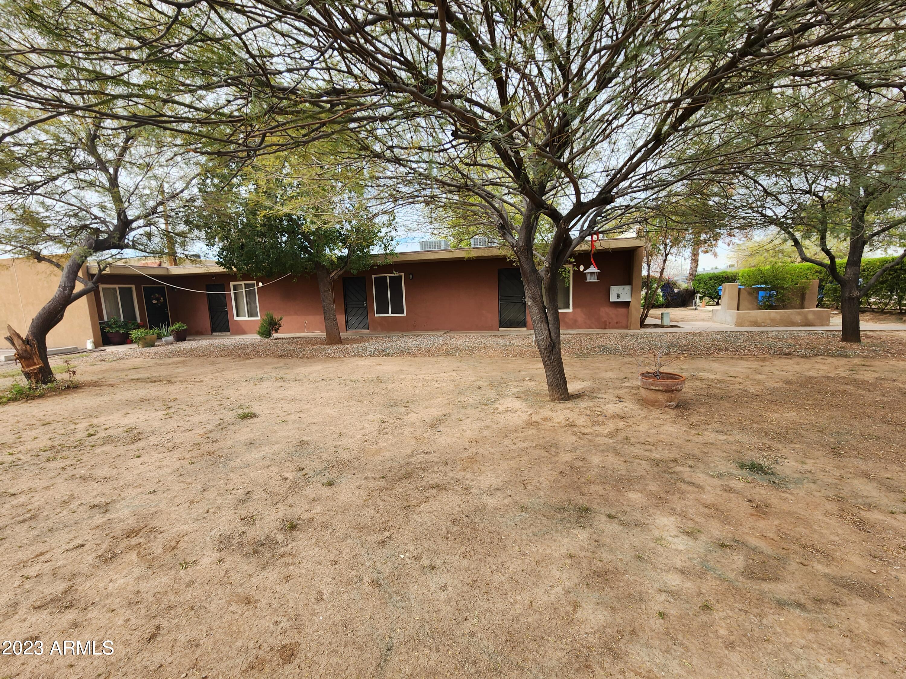 2735 West Tuckey Lane, Unit 2 Phoenix, AZ 85017 - Photo 1 of 8 a house with trees in front of it