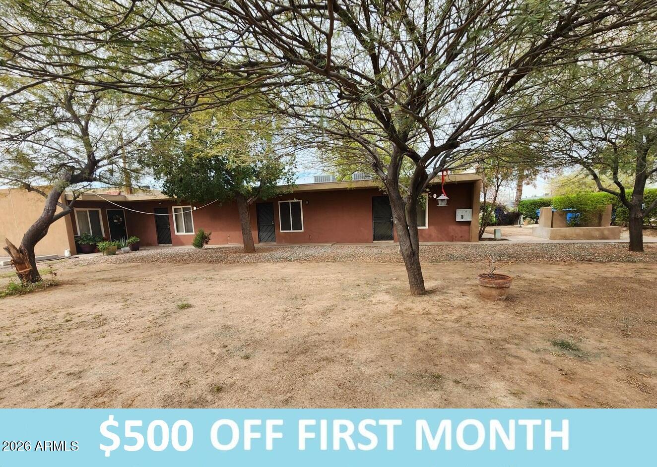 a view of a yard with large trees