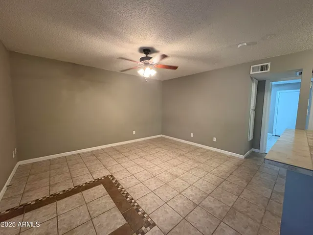 a view of a big room with windows